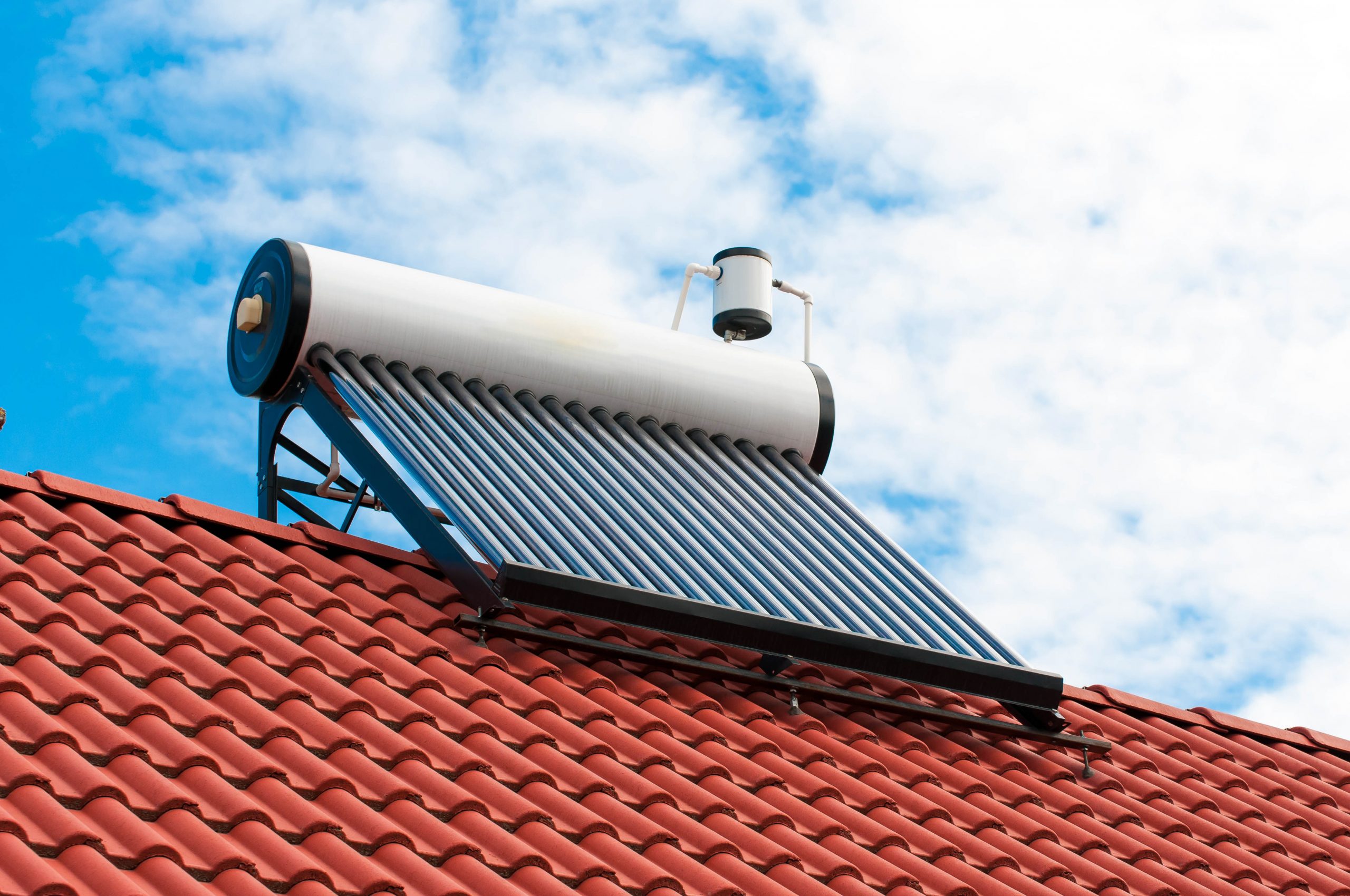 Solar,Water,Heater,On,Roof,Top,,Beautiful,Blue,Sky,Background.